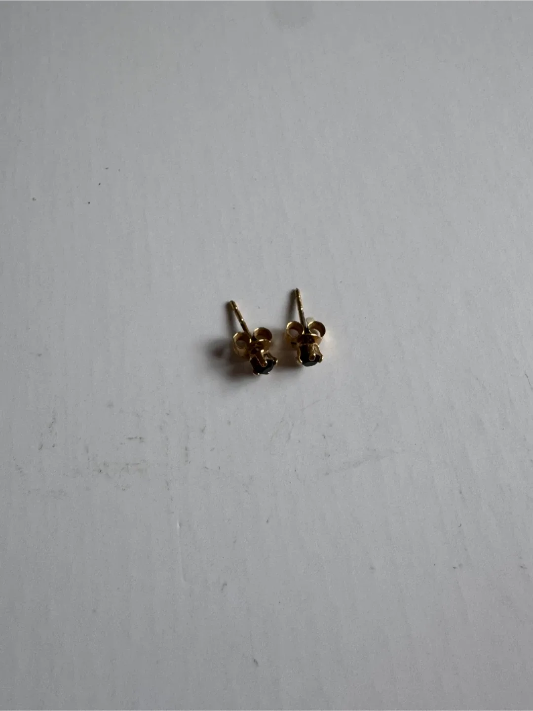 Gold Stud Earrings with Black Gemstones image indicator(4)