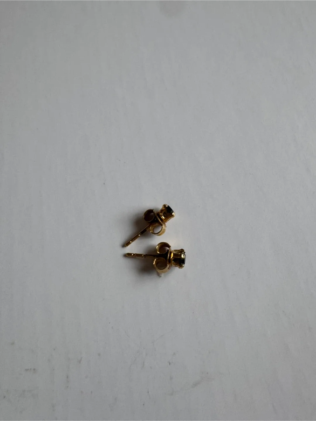 Gold Stud Earrings with Black Gemstones image indicator(6)