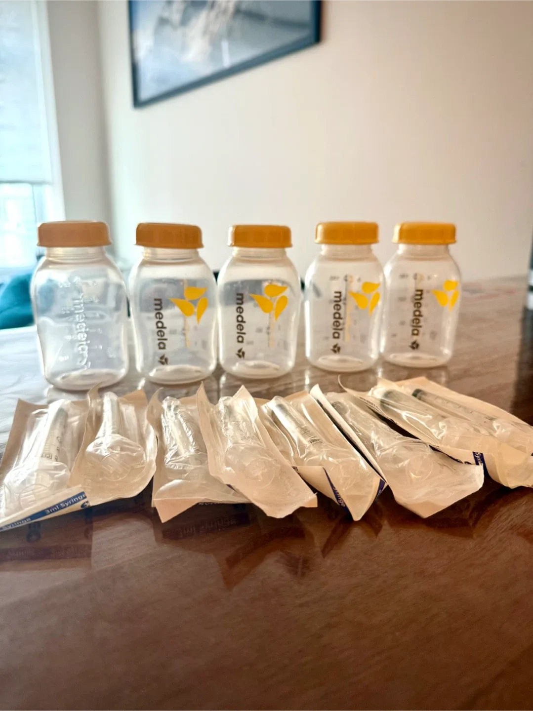 5 Medela Breast Milk Bottles + 8 Baby Feeding Syringes