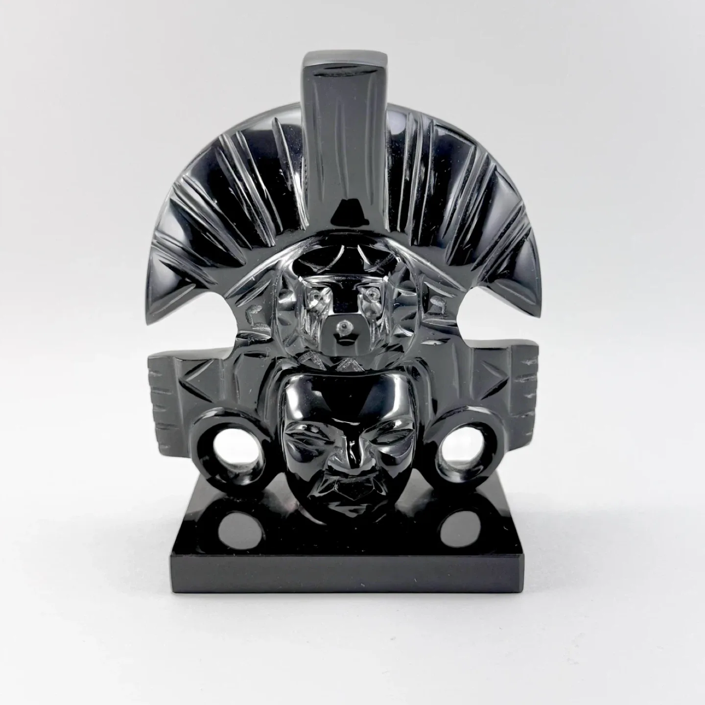 Small polished black obsidian Mayan caving