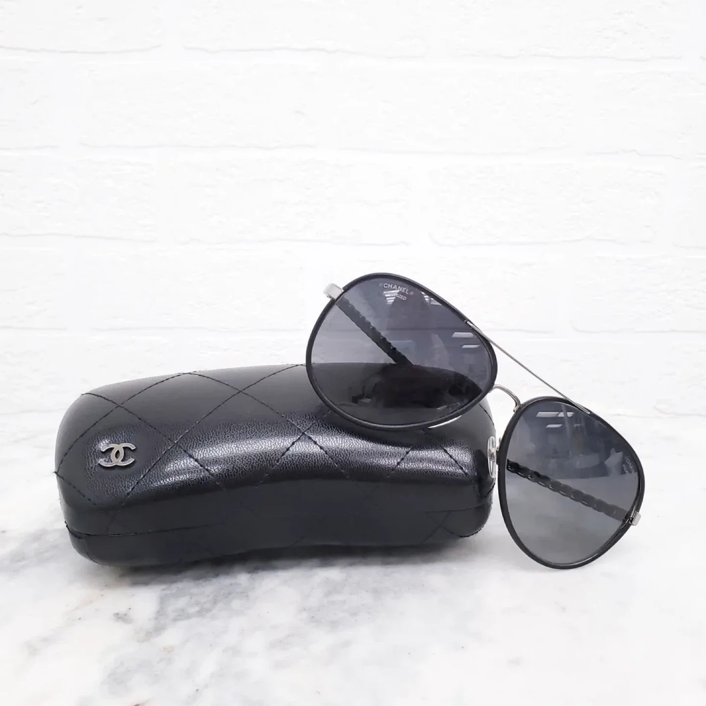 Women’s Chanel sunglasses aviators.