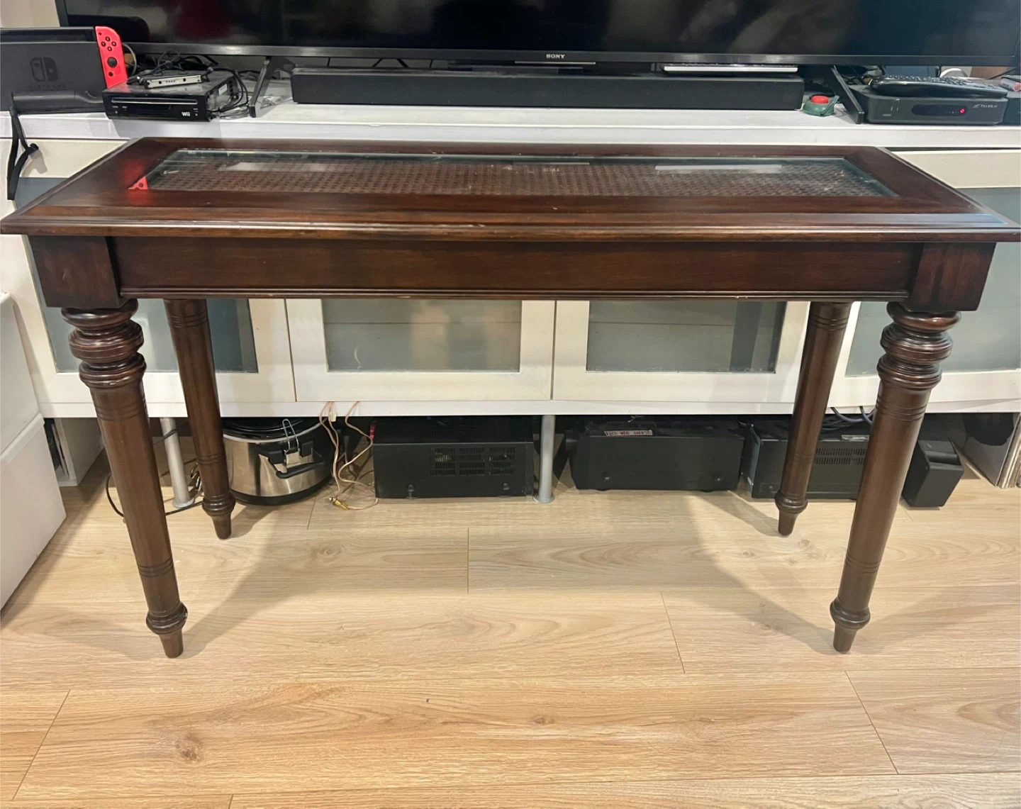 Foyer or hallway table with wicker and glass top