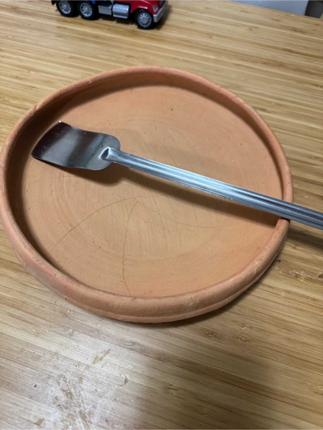 Matir khola with steel spoon