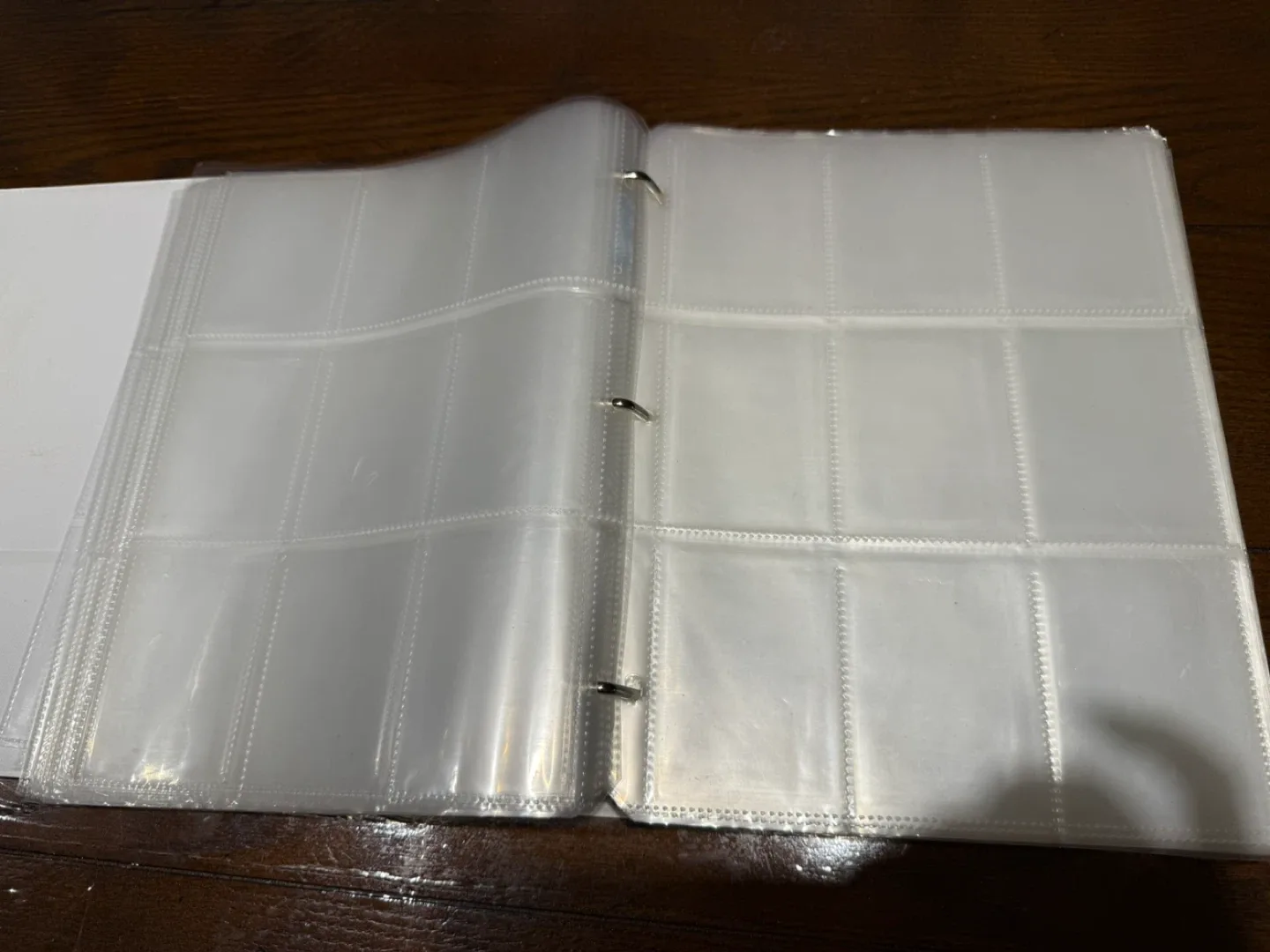 White Binder with pocket trading card sleeves image indicator(2)