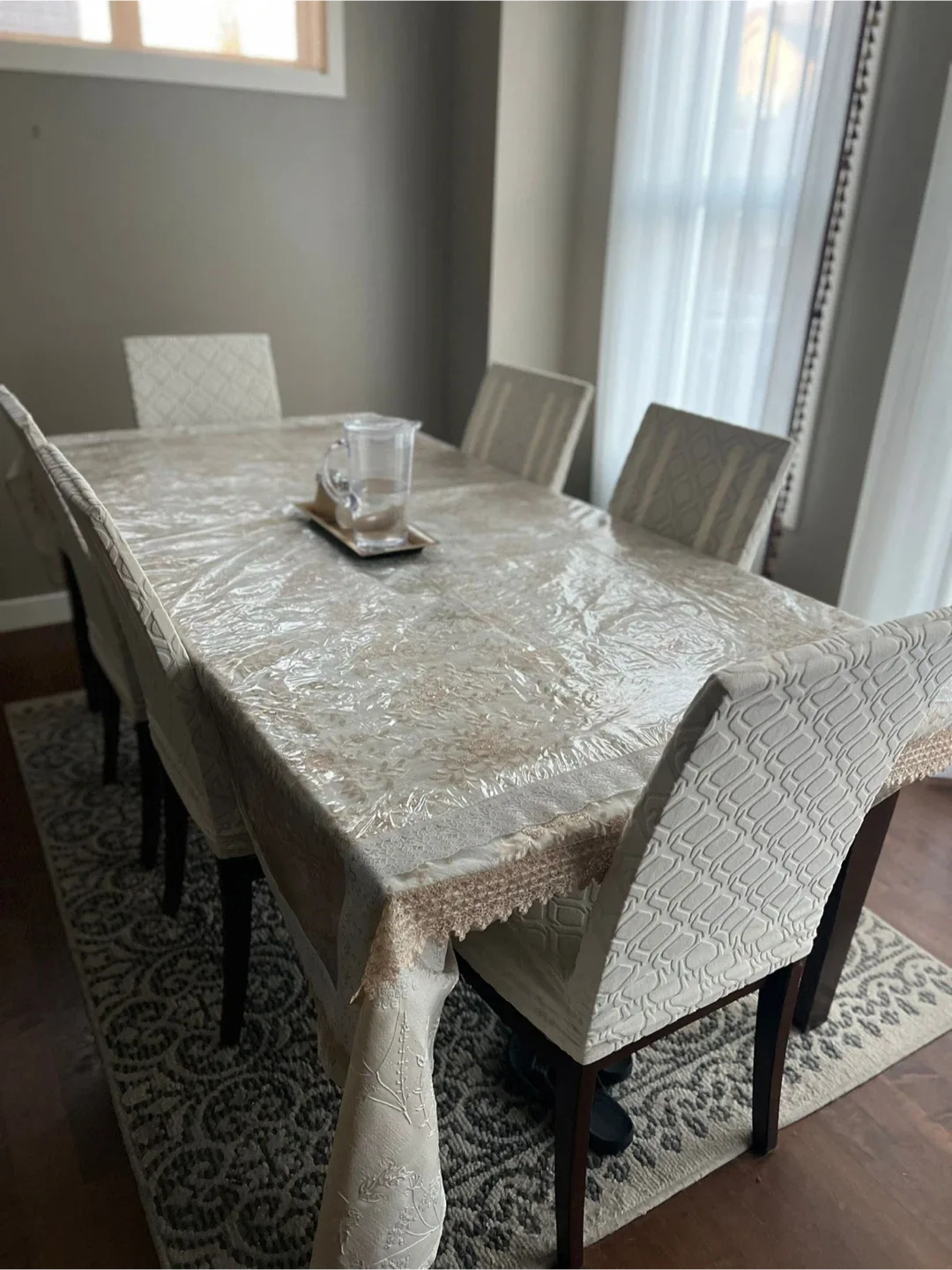 Dining table with 6 chairs and rug