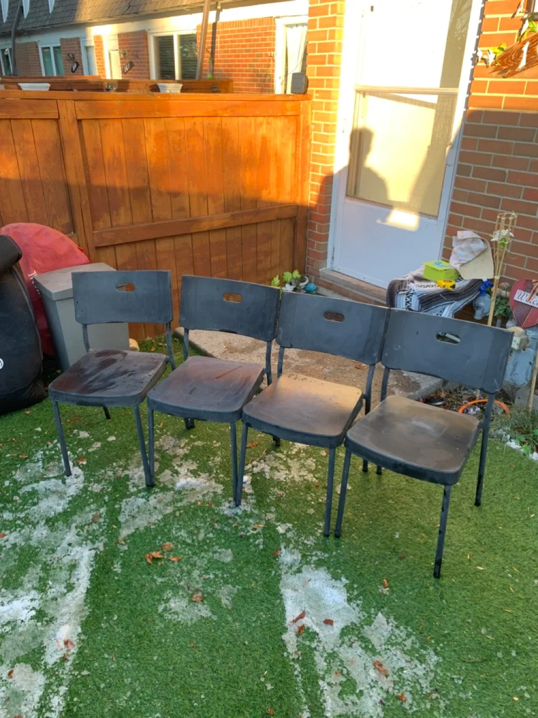 Four Black Plastic Chairs - furniture