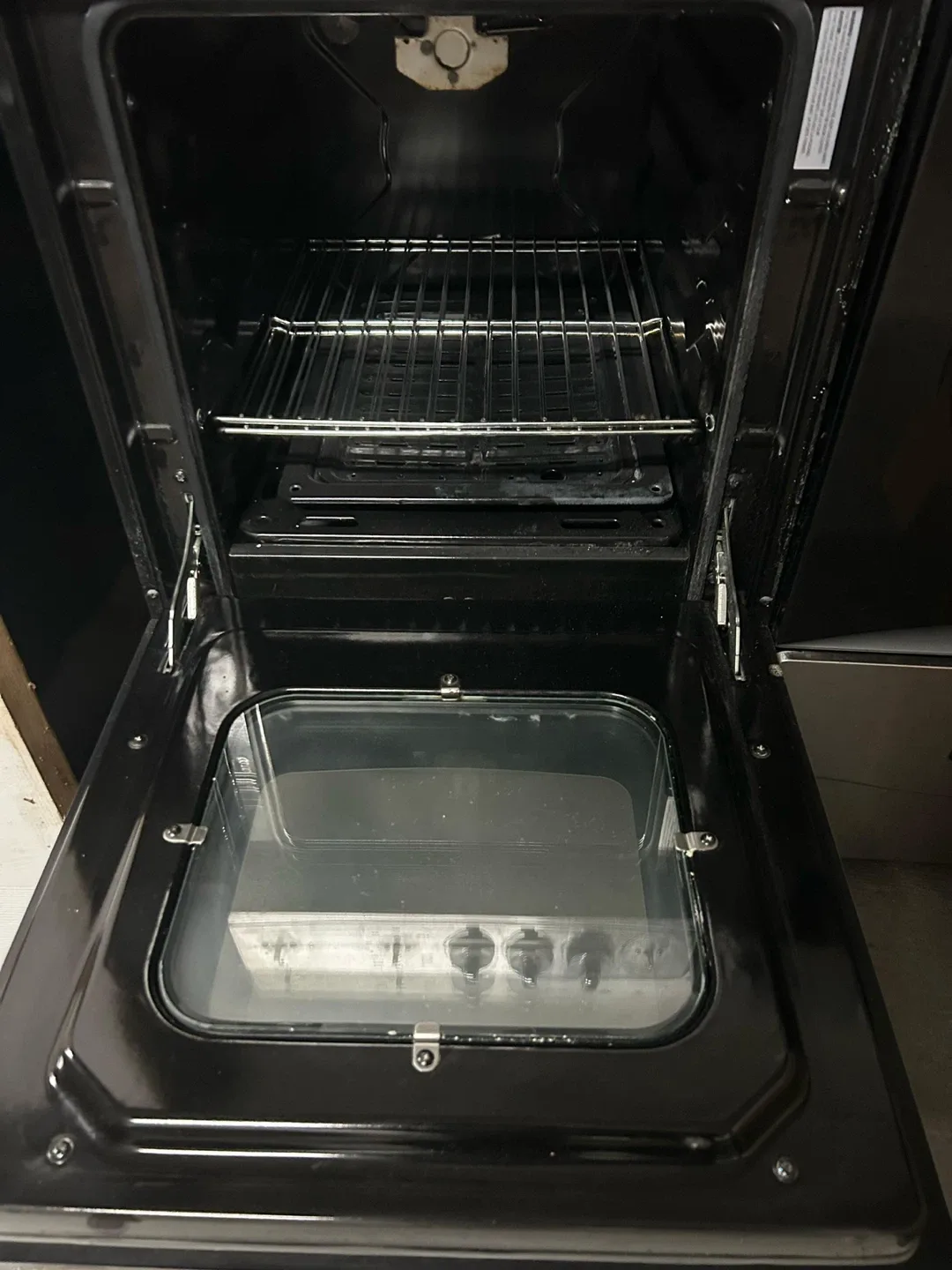 Stainless steel free standing refrigerator and one gas stove.. image indicator(4)