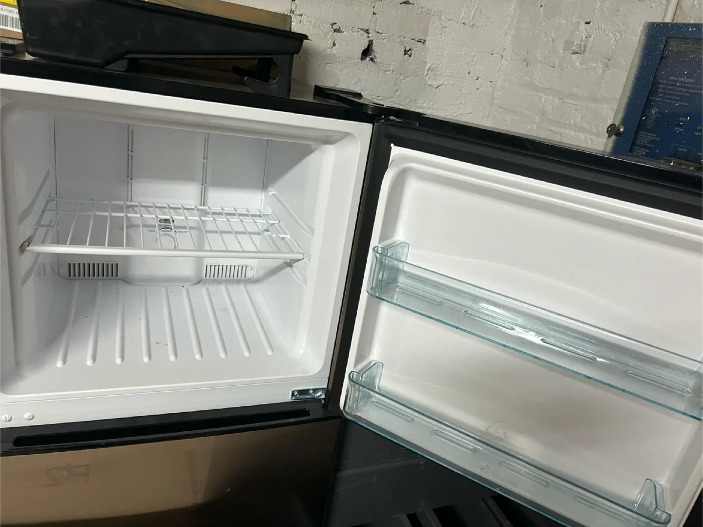 Stainless steel free standing refrigerator and one gas stove.. image indicator(2)