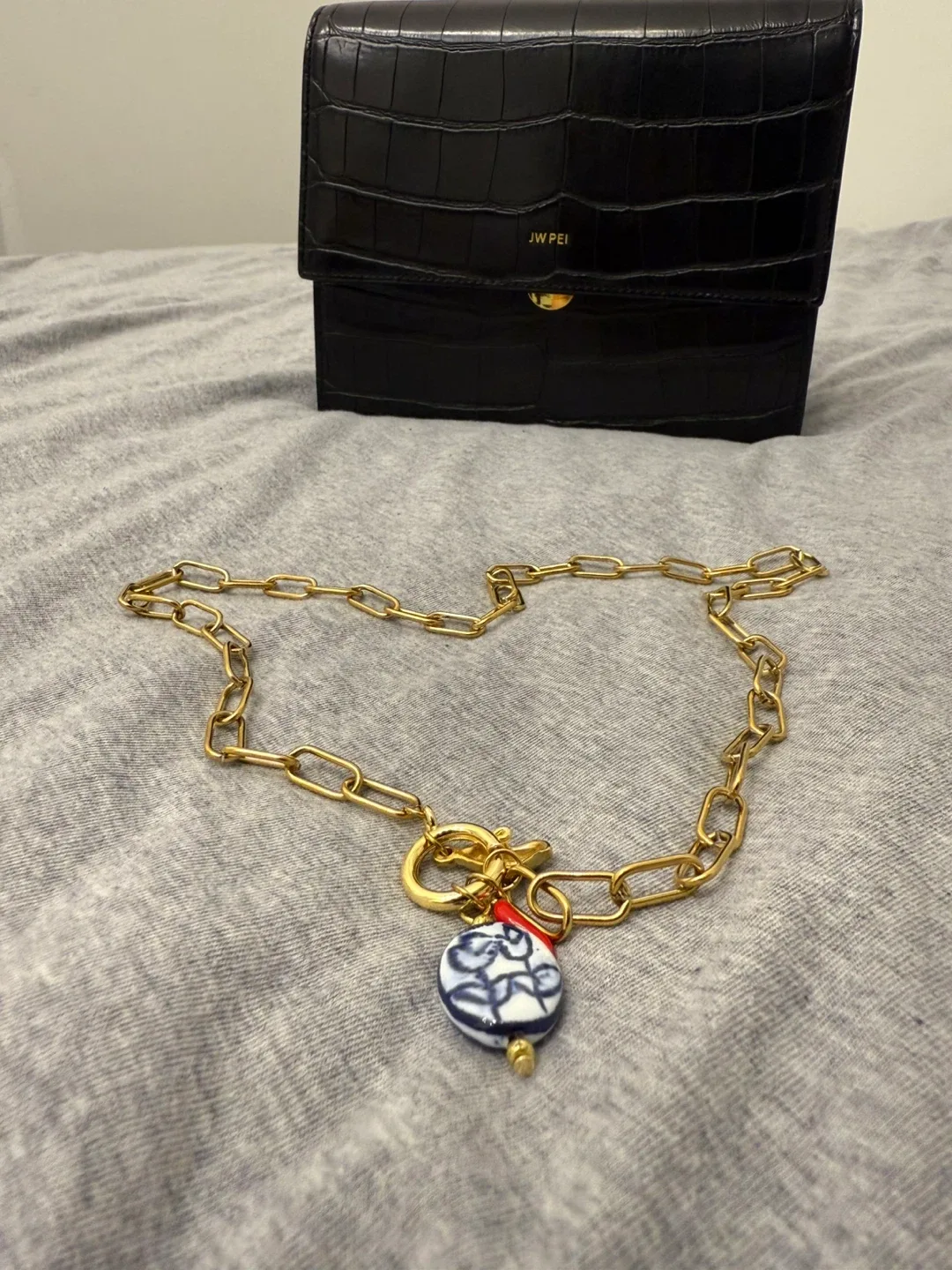 Gold Chain Necklace with Blue & White Charm image indicator(6)