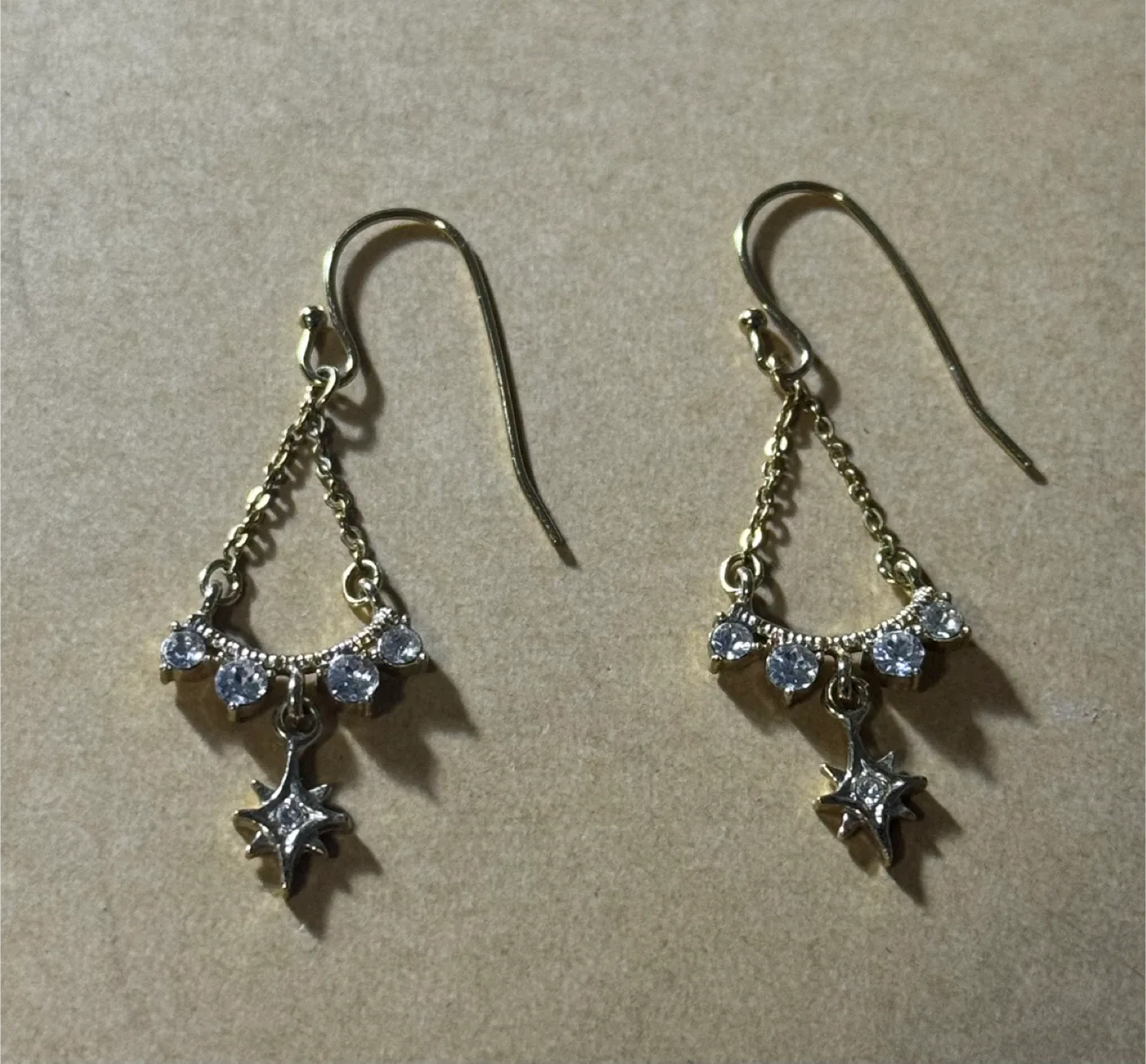 Gold Tone Star Dangle Earrings