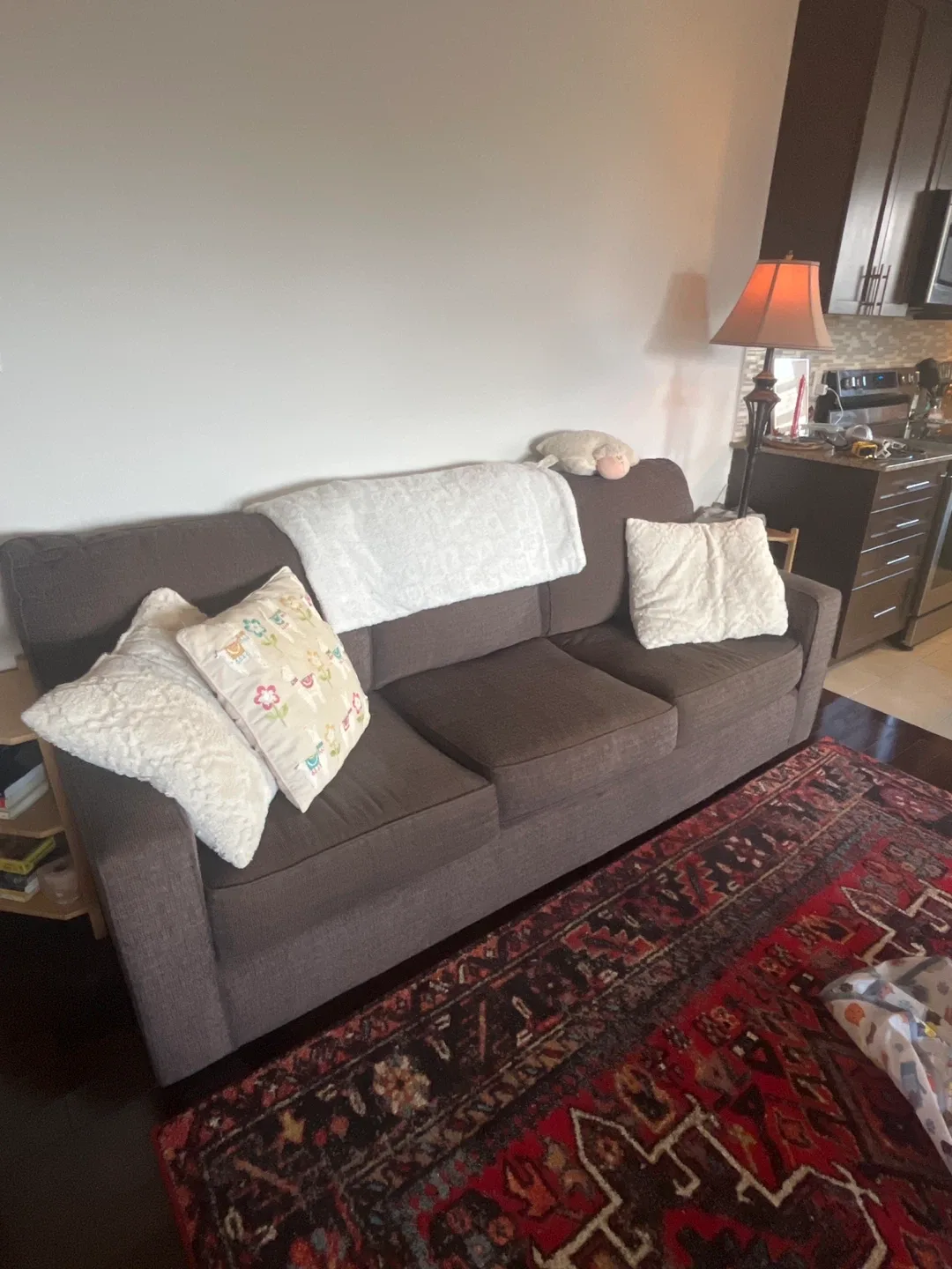 Brown three seat sofa