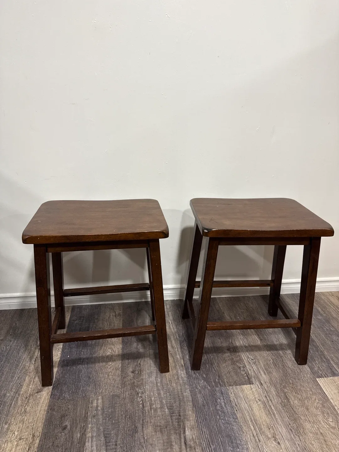 Two Brown Wooden Bar Stools