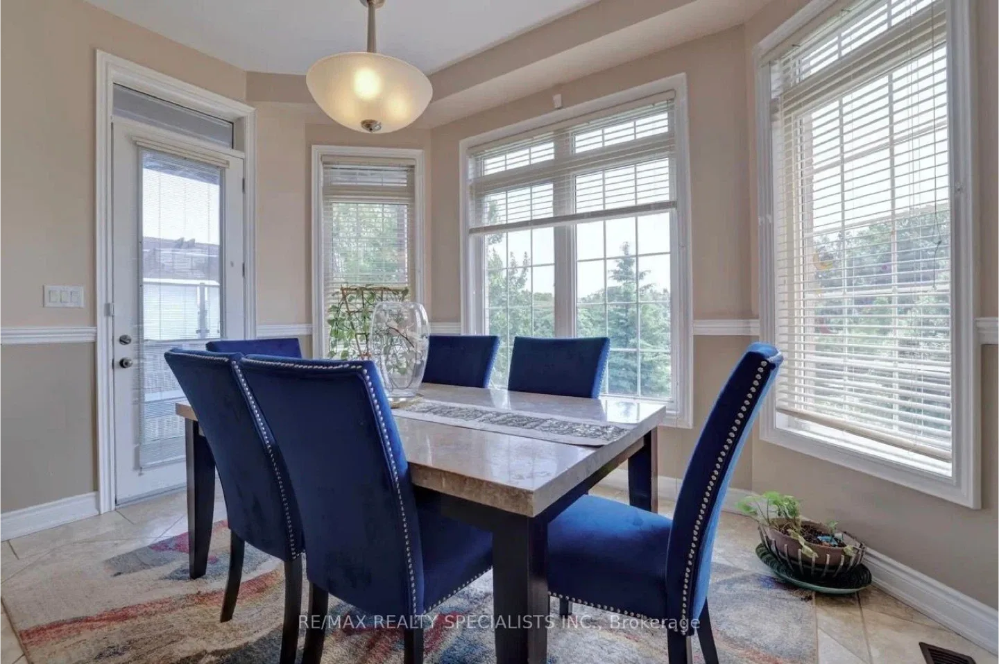 Dining Table with Blue Velvet Chairs