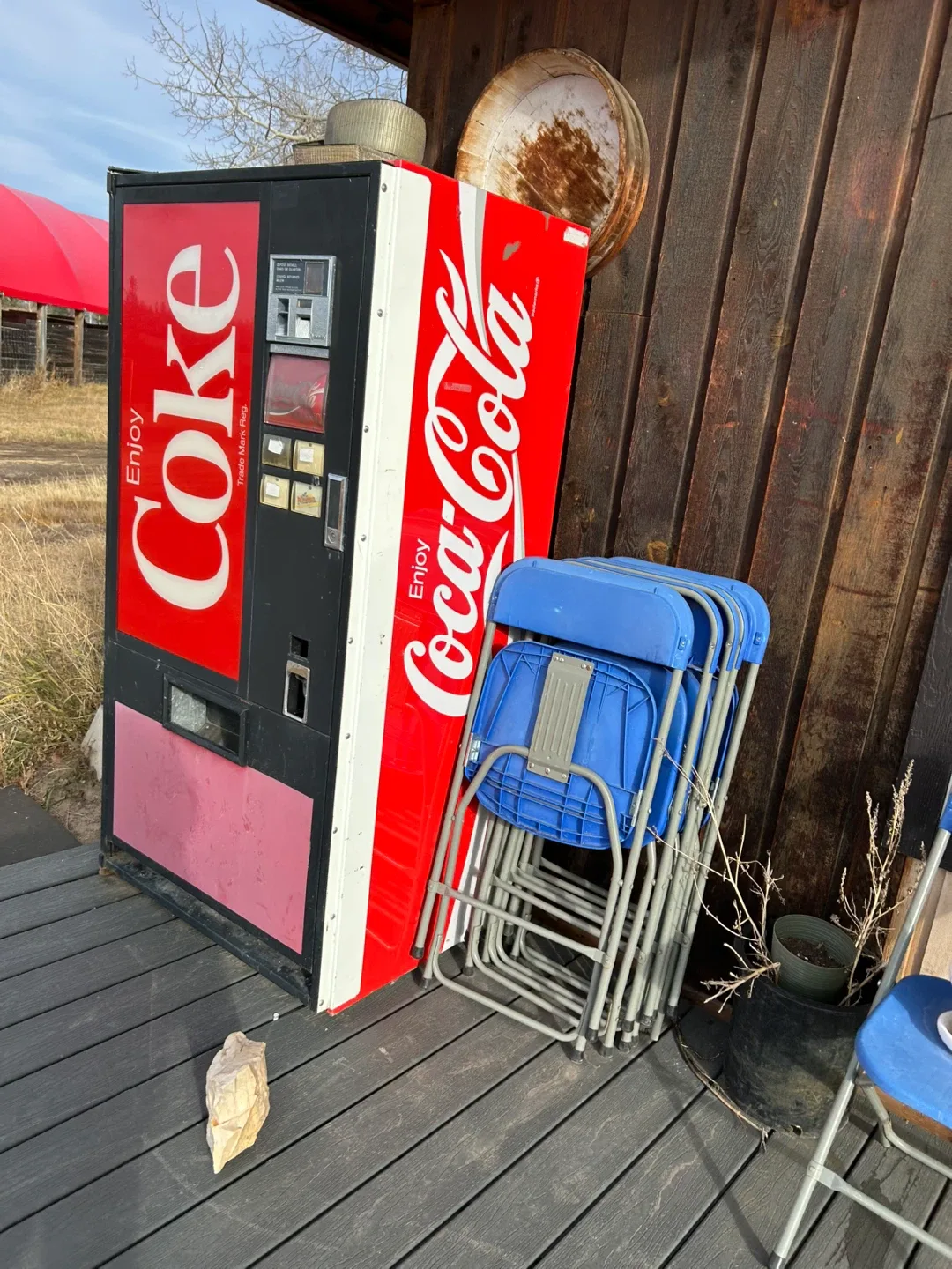 Coca-Cola Vending Machine & Blue Chairs