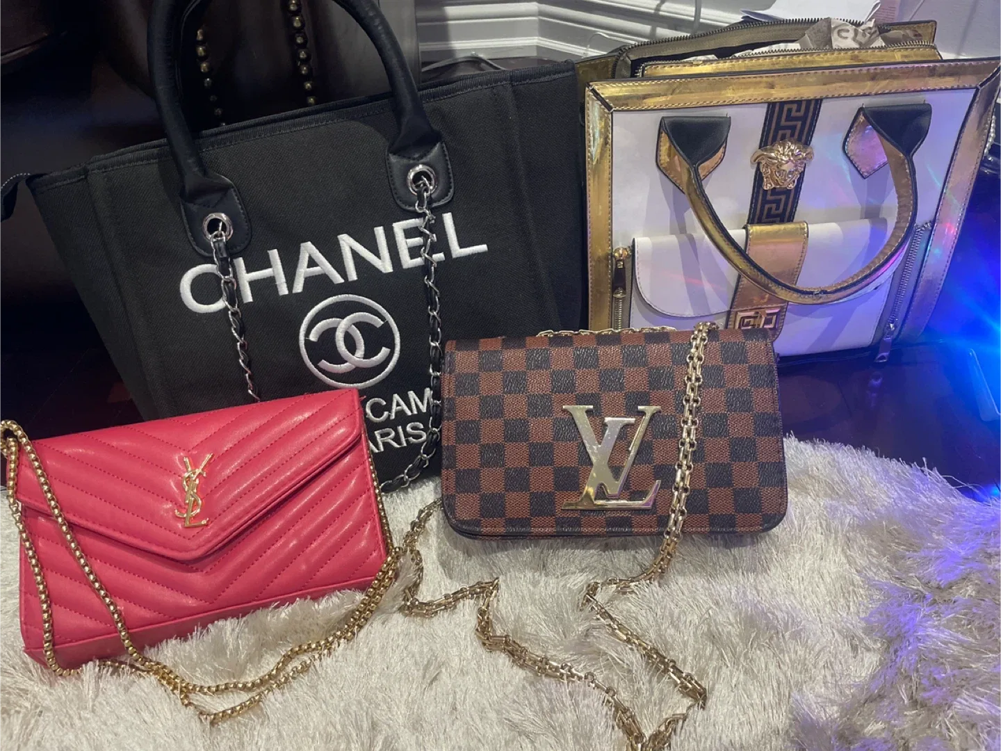 Handbags: Chanel, YSL, Louis Vuitton, Versace