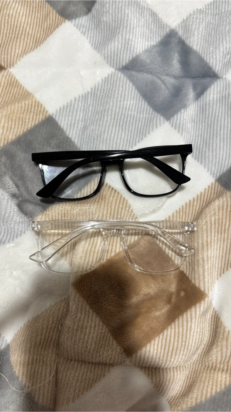 Two pairs of glasses - Black and Clear image indicator(2)