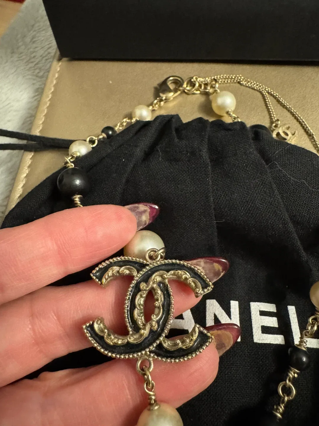 Authentic Chanel Pearl Necklace with Black and White Pearls image indicator(2)