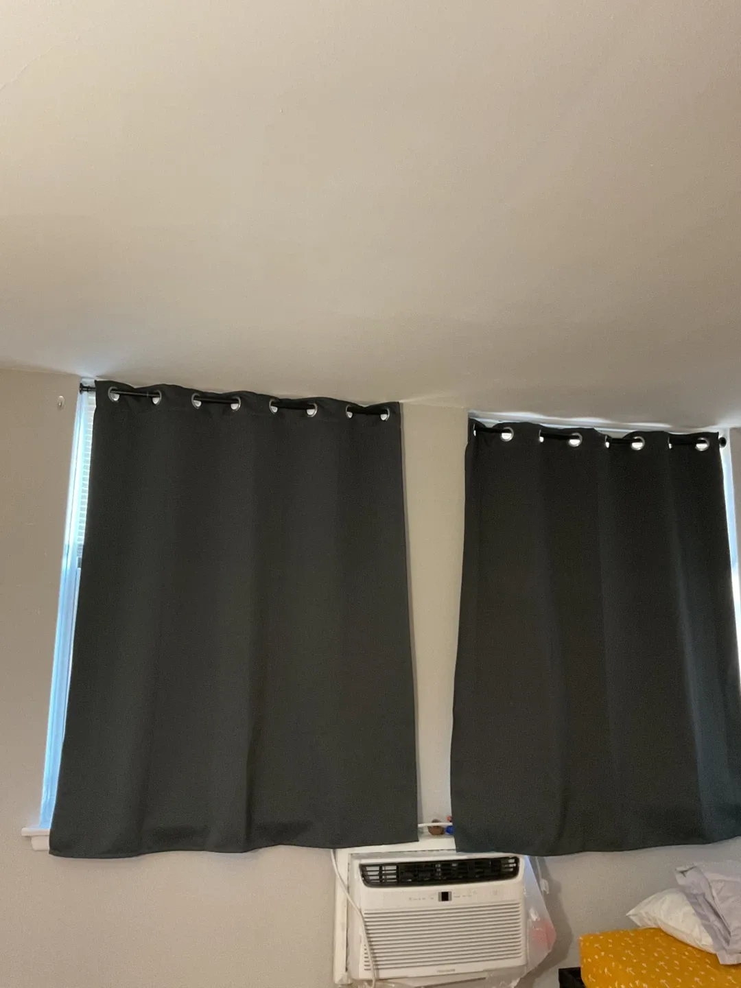 Pair of black out curtains with rods