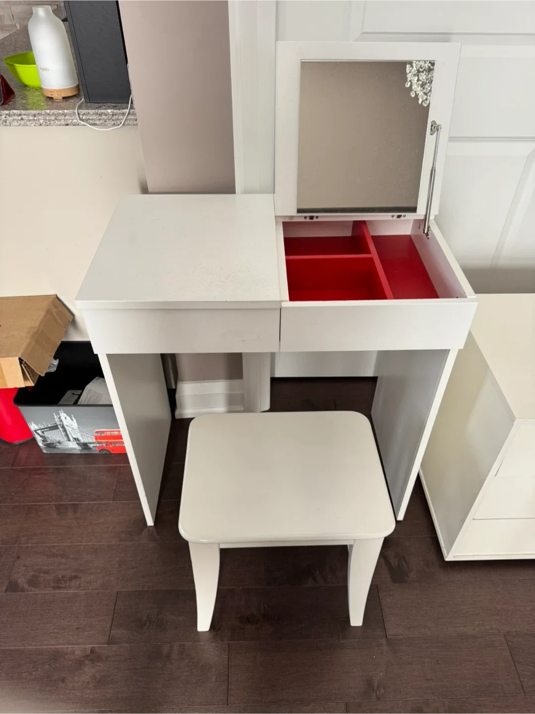 white vanity with chair and lamp