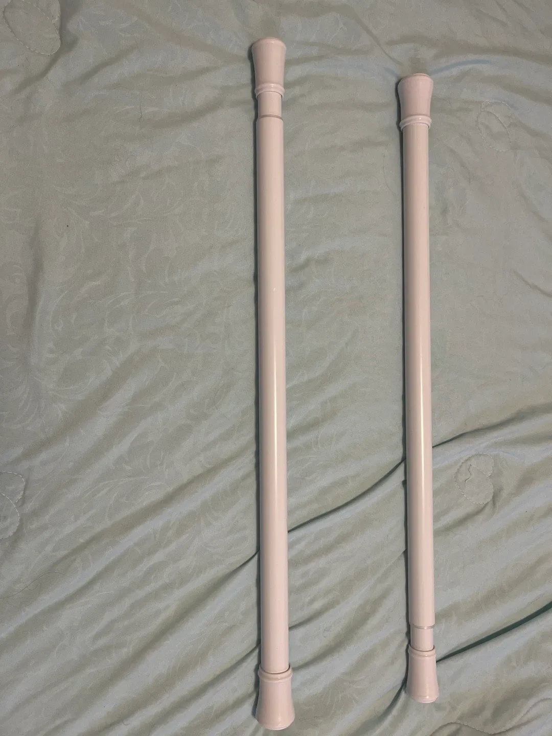 Shower curtain tension rod.