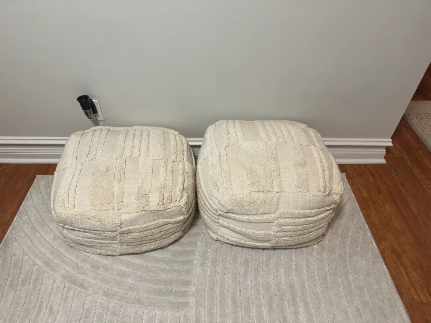 Two Off-White Poufs image indicator(2)