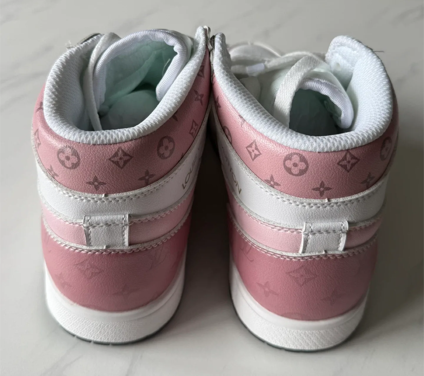 Louis Vuitton Pink High-Top Sneakers image indicator(2)
