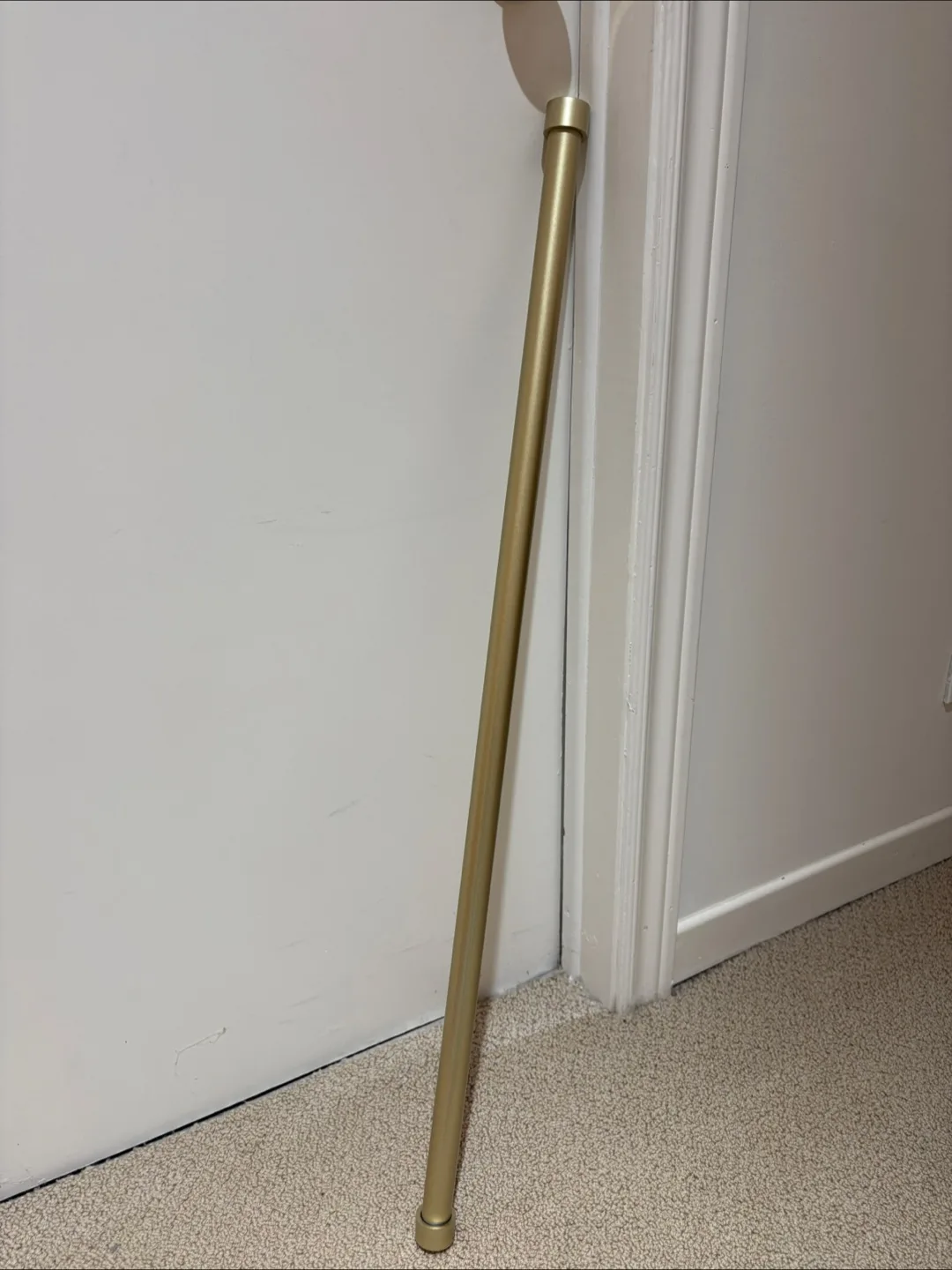 Retractable curtain rod (Extends up to 70”)