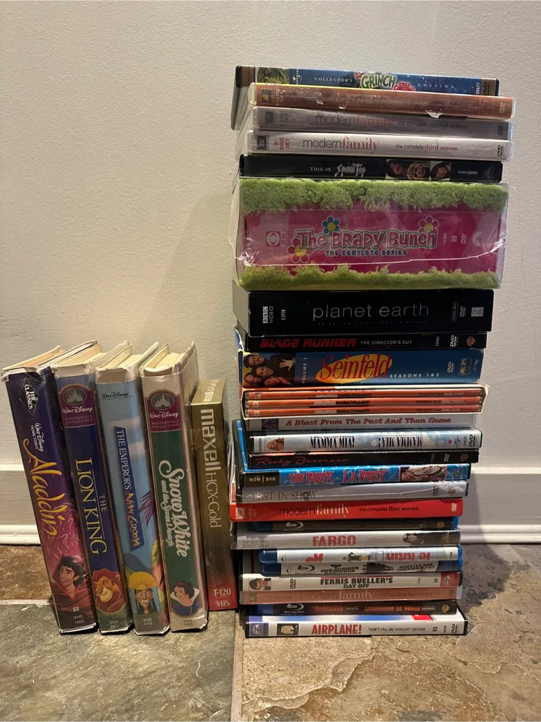 Mixed Lot of VHS and DVDs: Disney, Modern Family