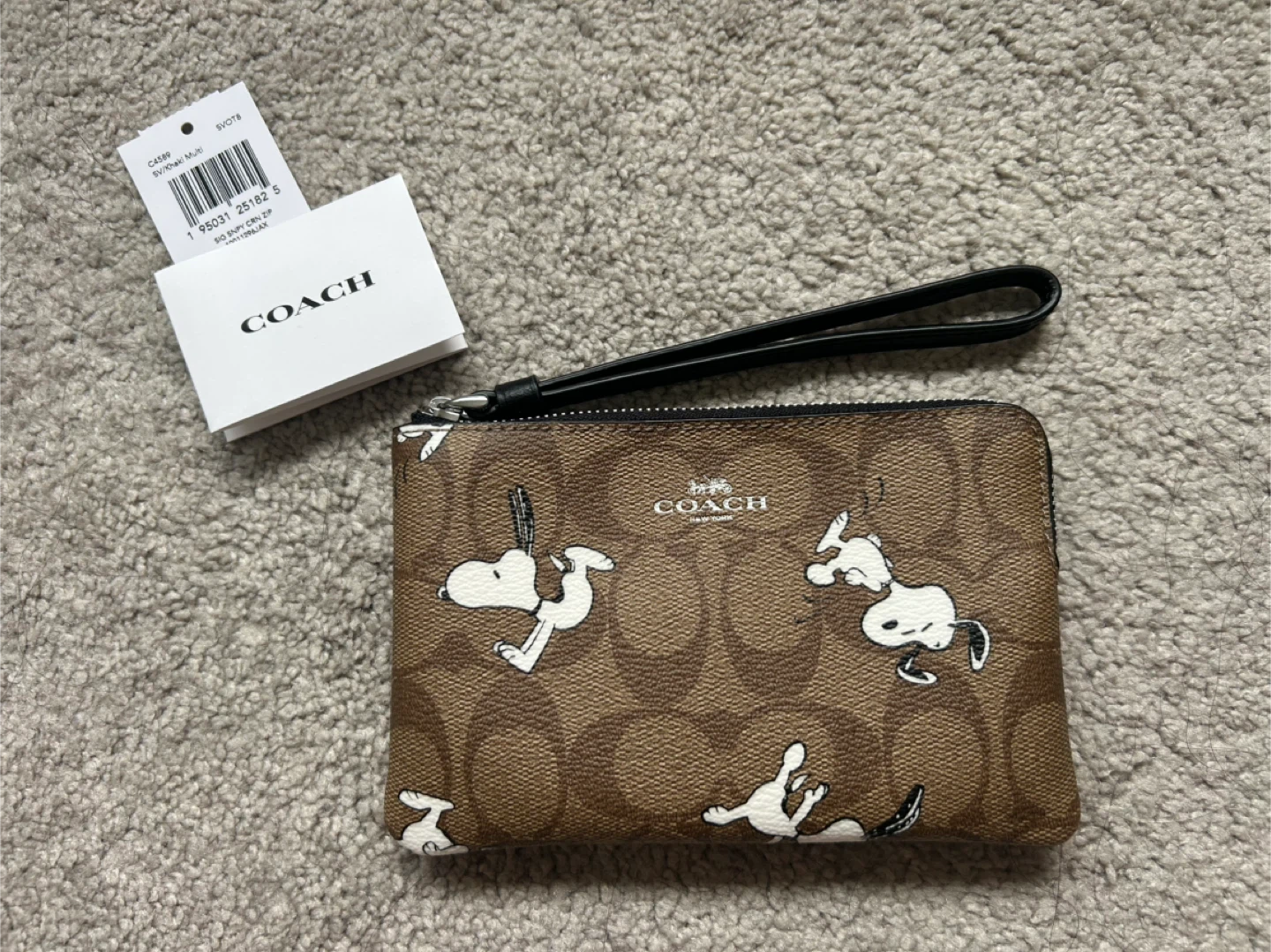 Coach peanuts snoopy corner zip Wristlet