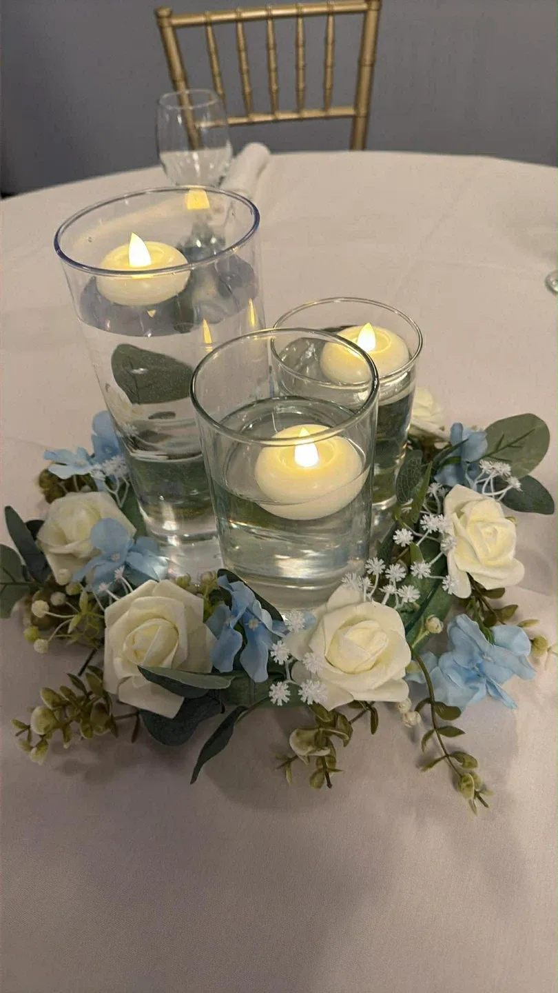 Floating Candles with Floral Arrangement
