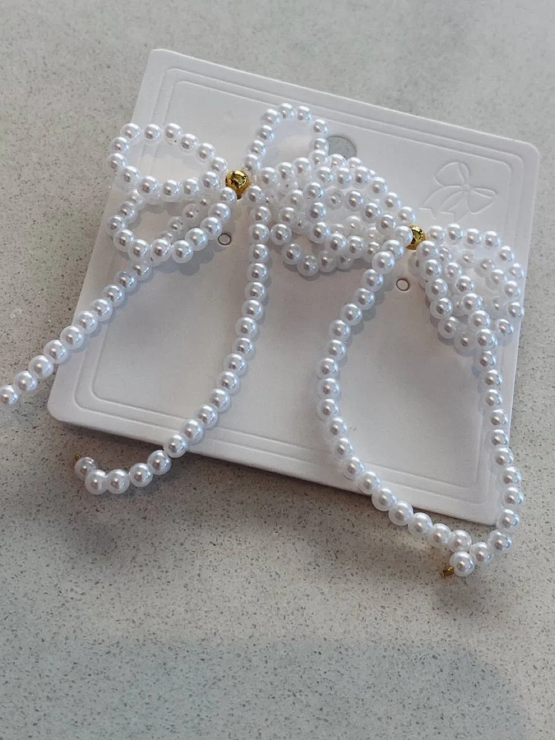 Bow & faux pearl earrings