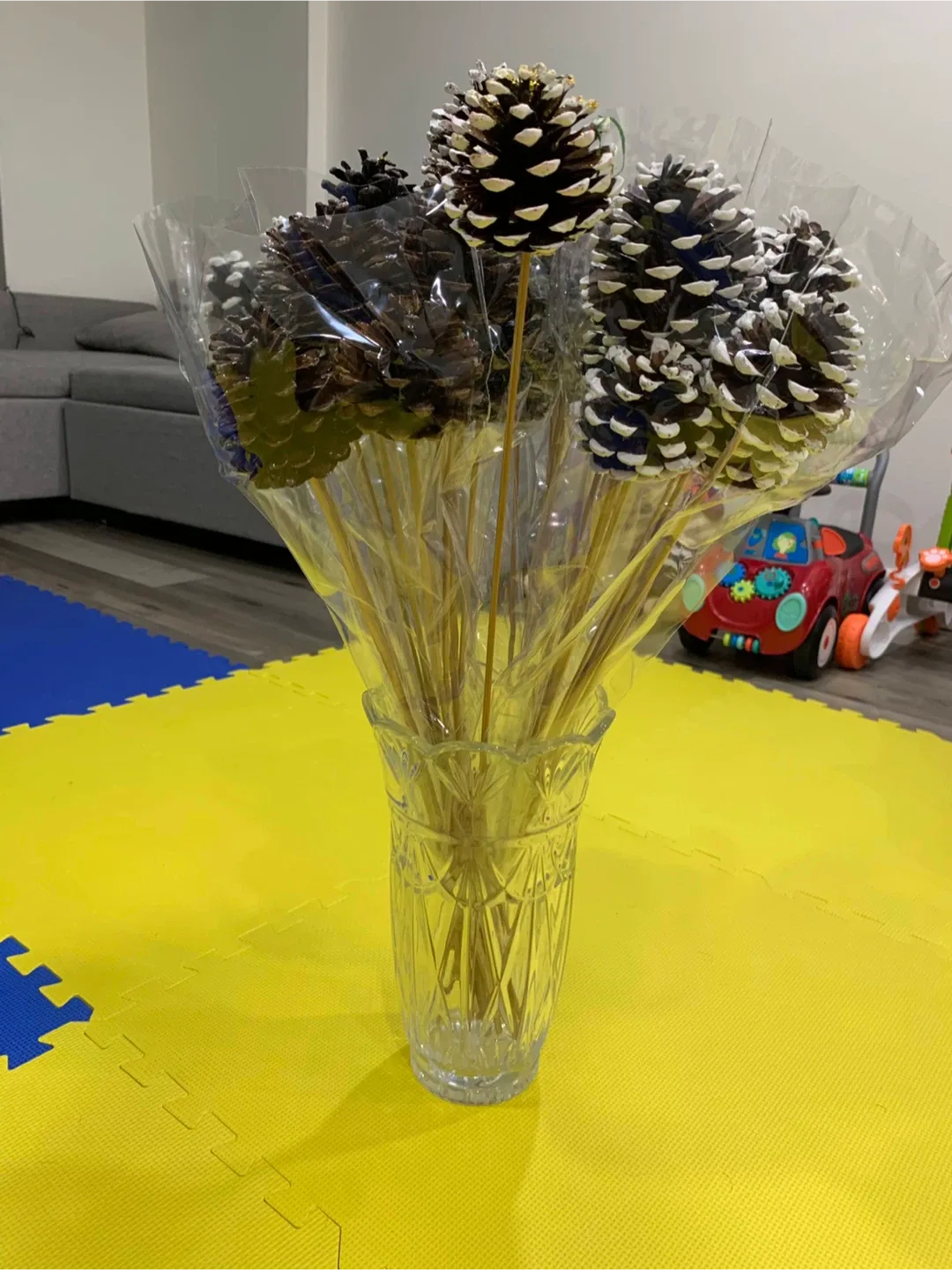 2.5”-3.5” pine cones with white sparkle tips on stems