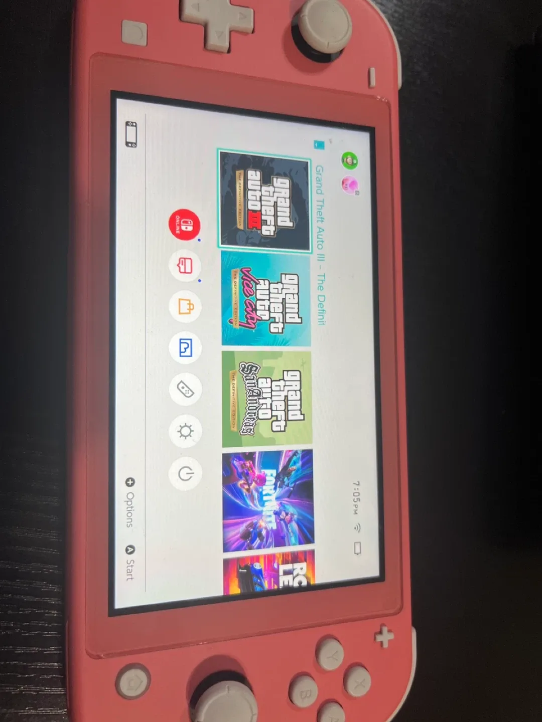 Nintendo Switch Lite Coral + 2 Games & Case image indicator(3)