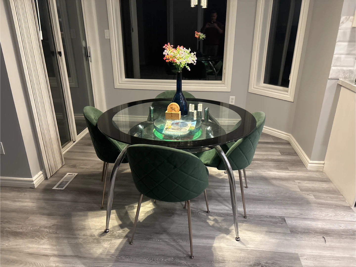 Round Glass Dining Table with 4 Green Velvet Chairs