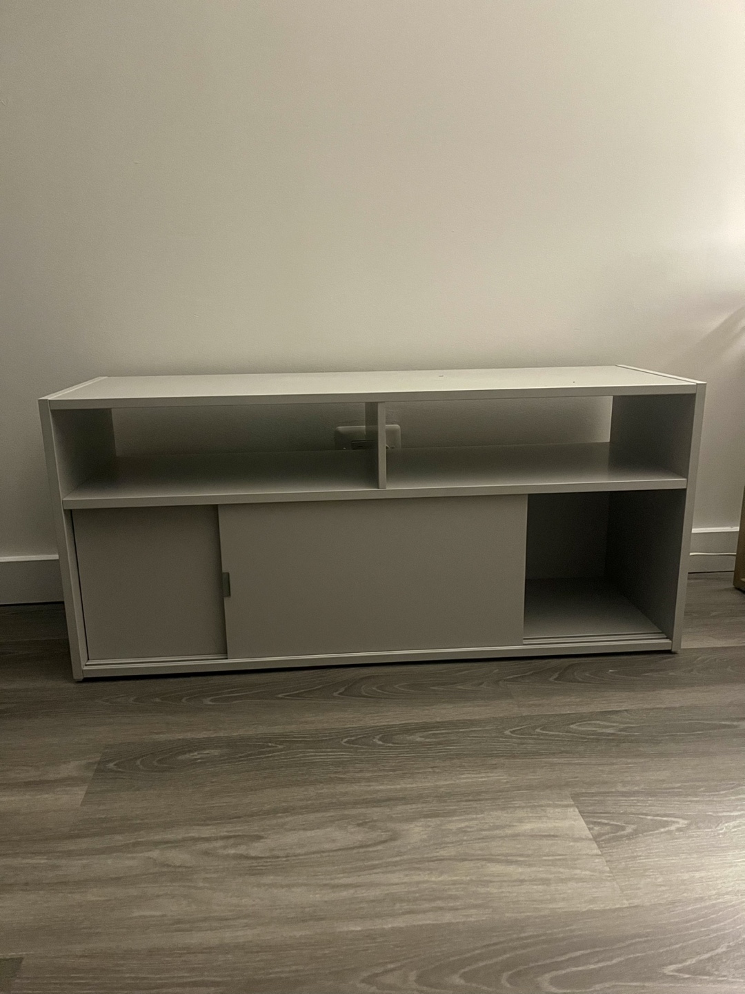 Modern & Sleek TV Stand with Shelves and Sliding Doors.
