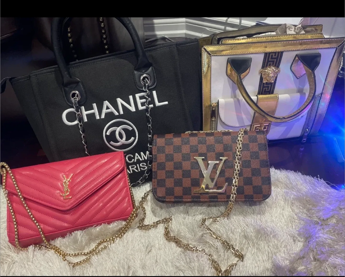 Handbags: Chanel, YSL, LV, Versace