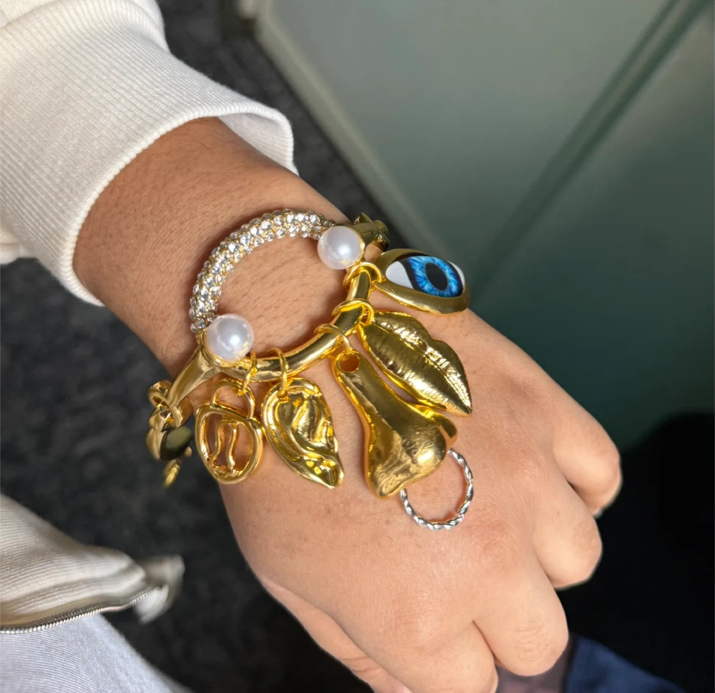 Schiaparelli Inspired facial feature Charm Bracelet image indicator(3)