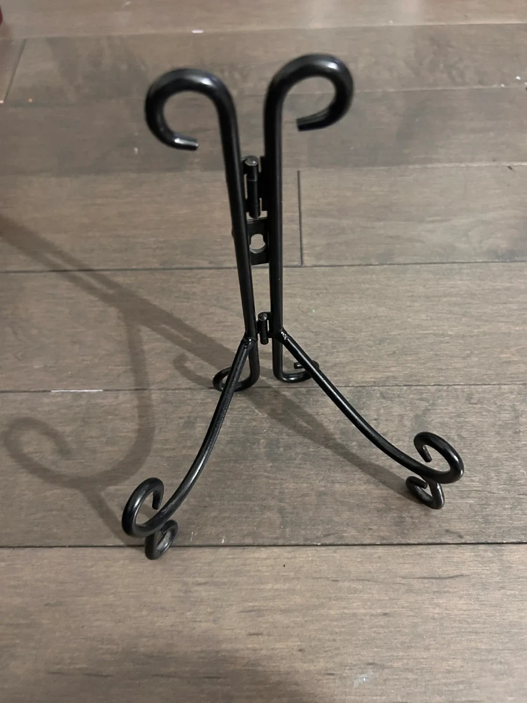 Black Metal Easel Stand. Can be hung on the wall