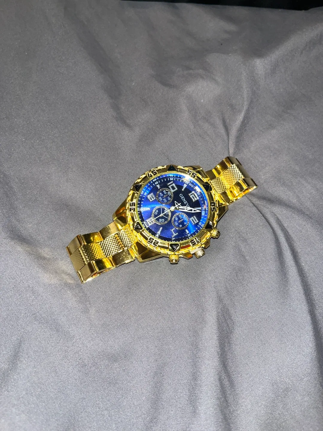 Montre Geneve dorée avec cadran bleu