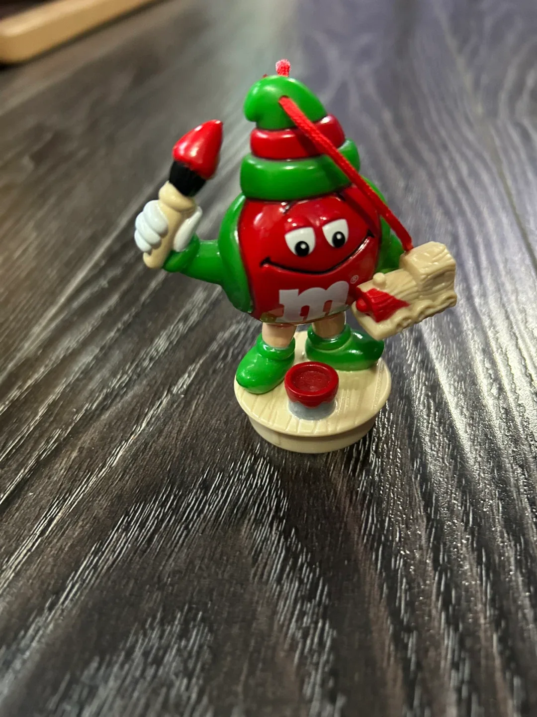 The red M&M topper decoration
