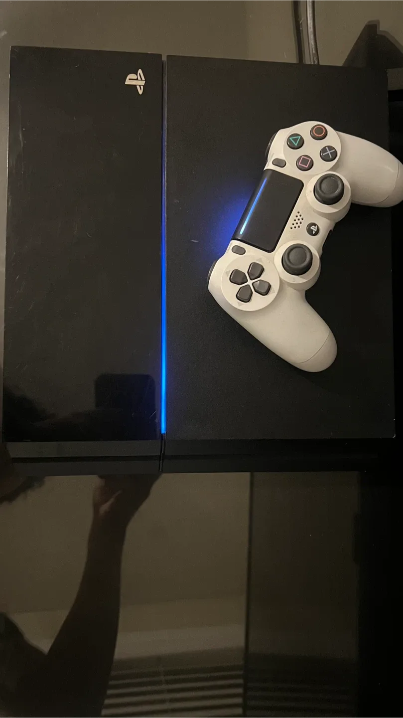 PlayStation 4 Console and White Controller