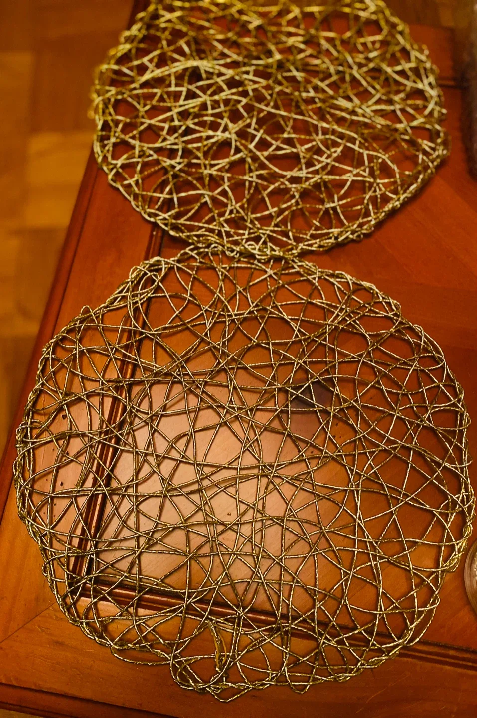 Gold Decorative Placemats (Set of 2), 13” diameter.