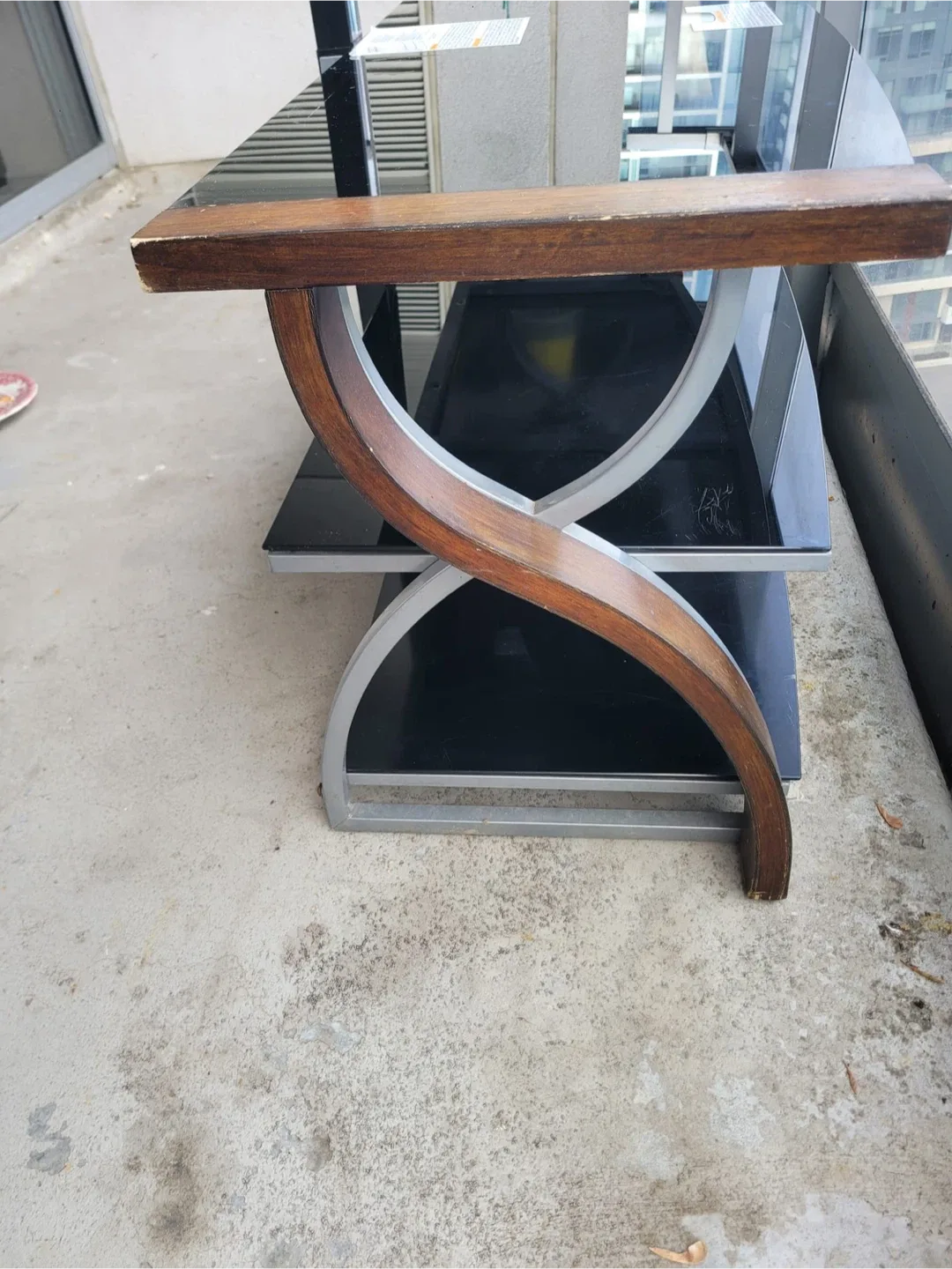 Black Glass TV Stand with Wooden Accents image indicator(4)