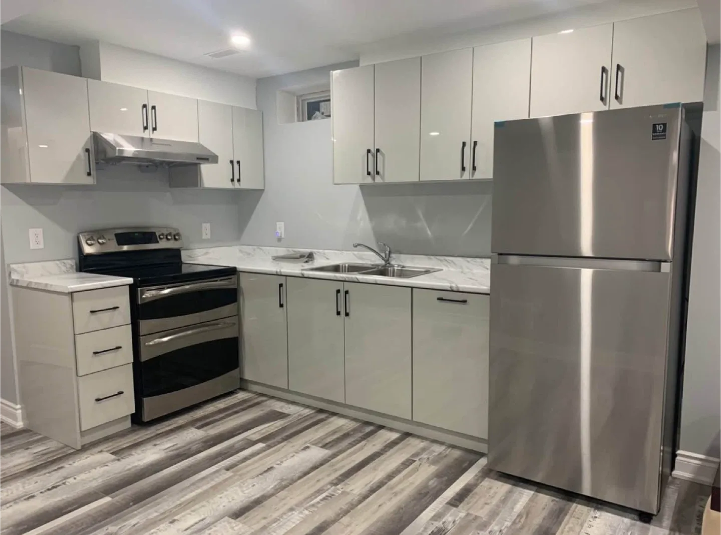 Kitchen cabinets and stainless steel fridge
