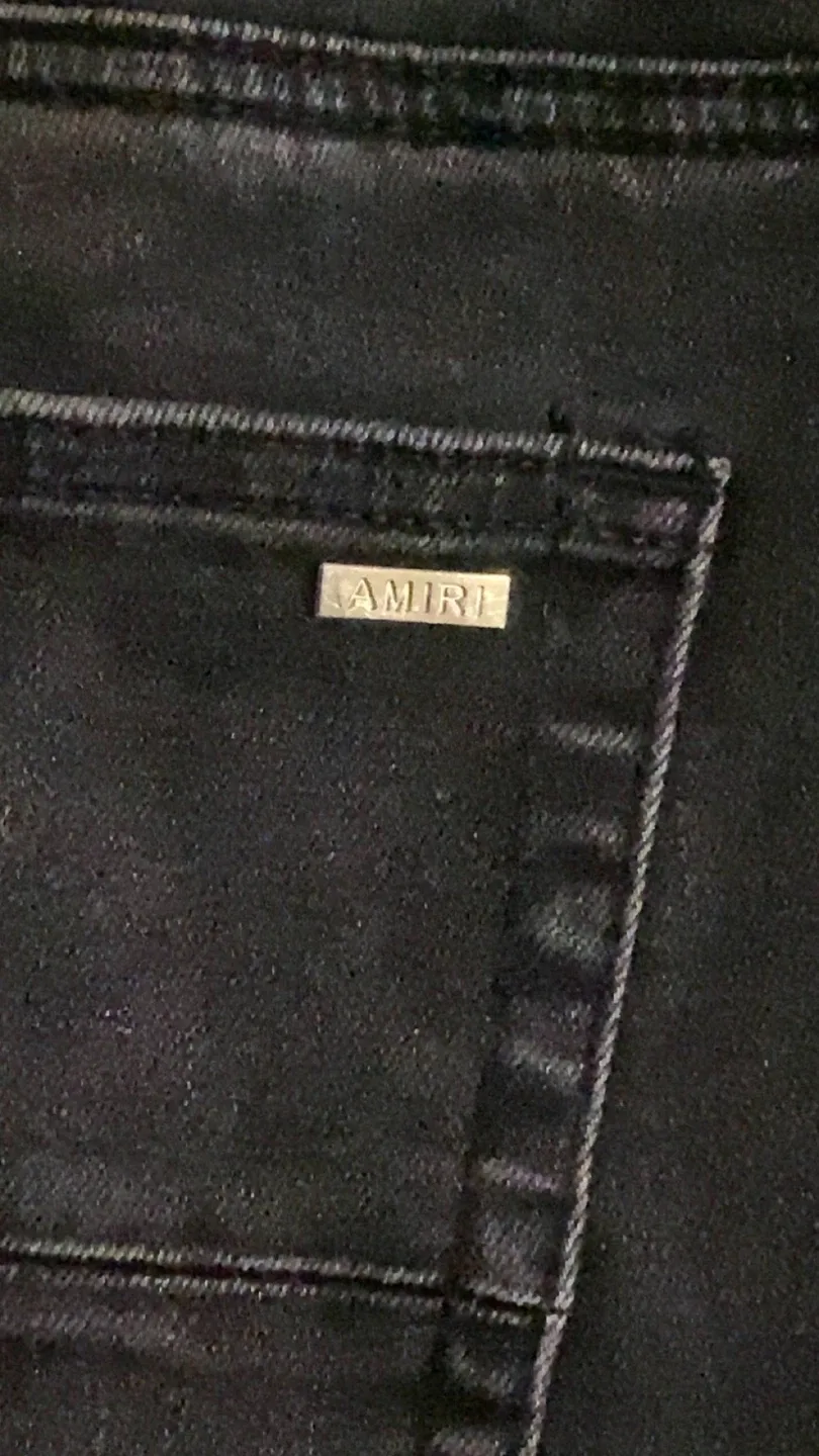 Amiri cracked paint jeans image indicator(2)