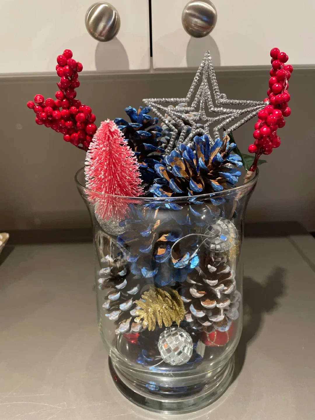 Christmas Pine Cone Arrangement in a glass vase