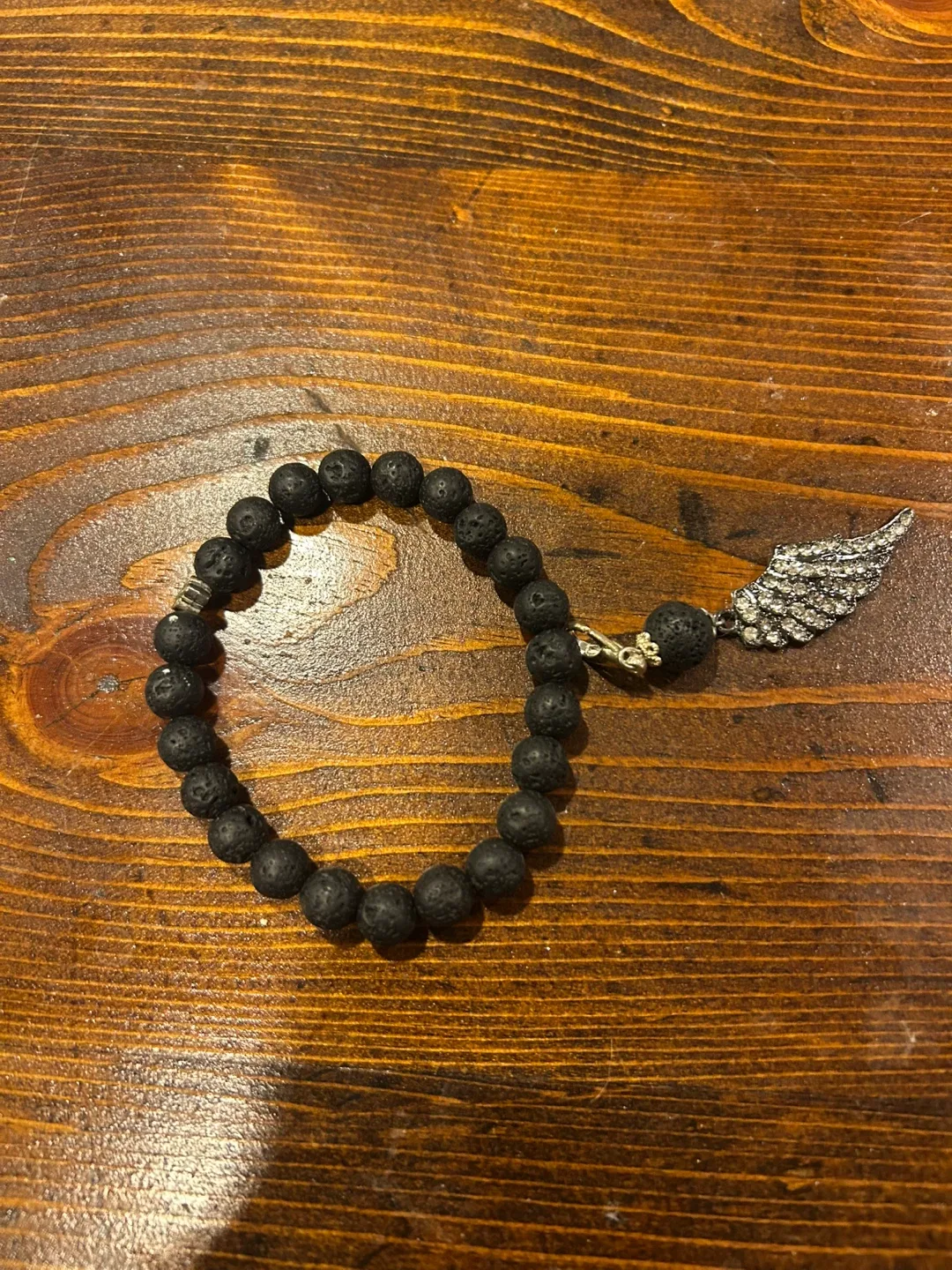 Lava Stone Bead Bracelet with Wing Charm