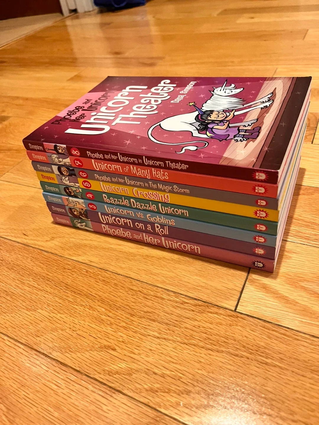 Phoebe and Her Unicorn Book Series by Dana Simpson image indicator(4)