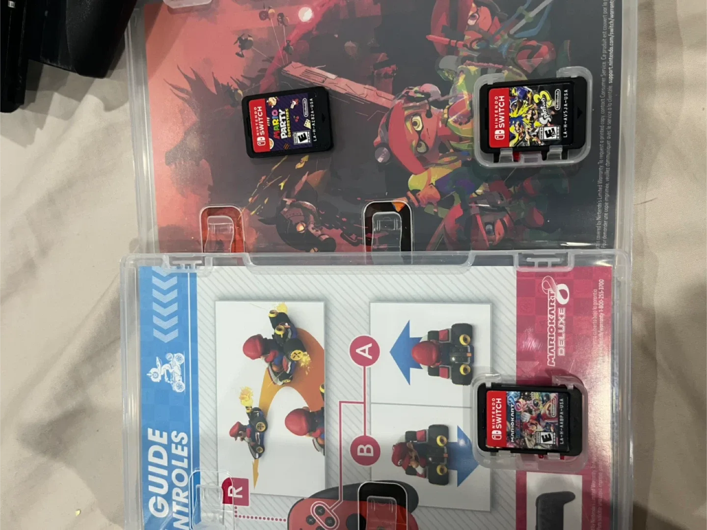 Nintendo Switch OLED with charging cable, doc, and games! image indicator(6)