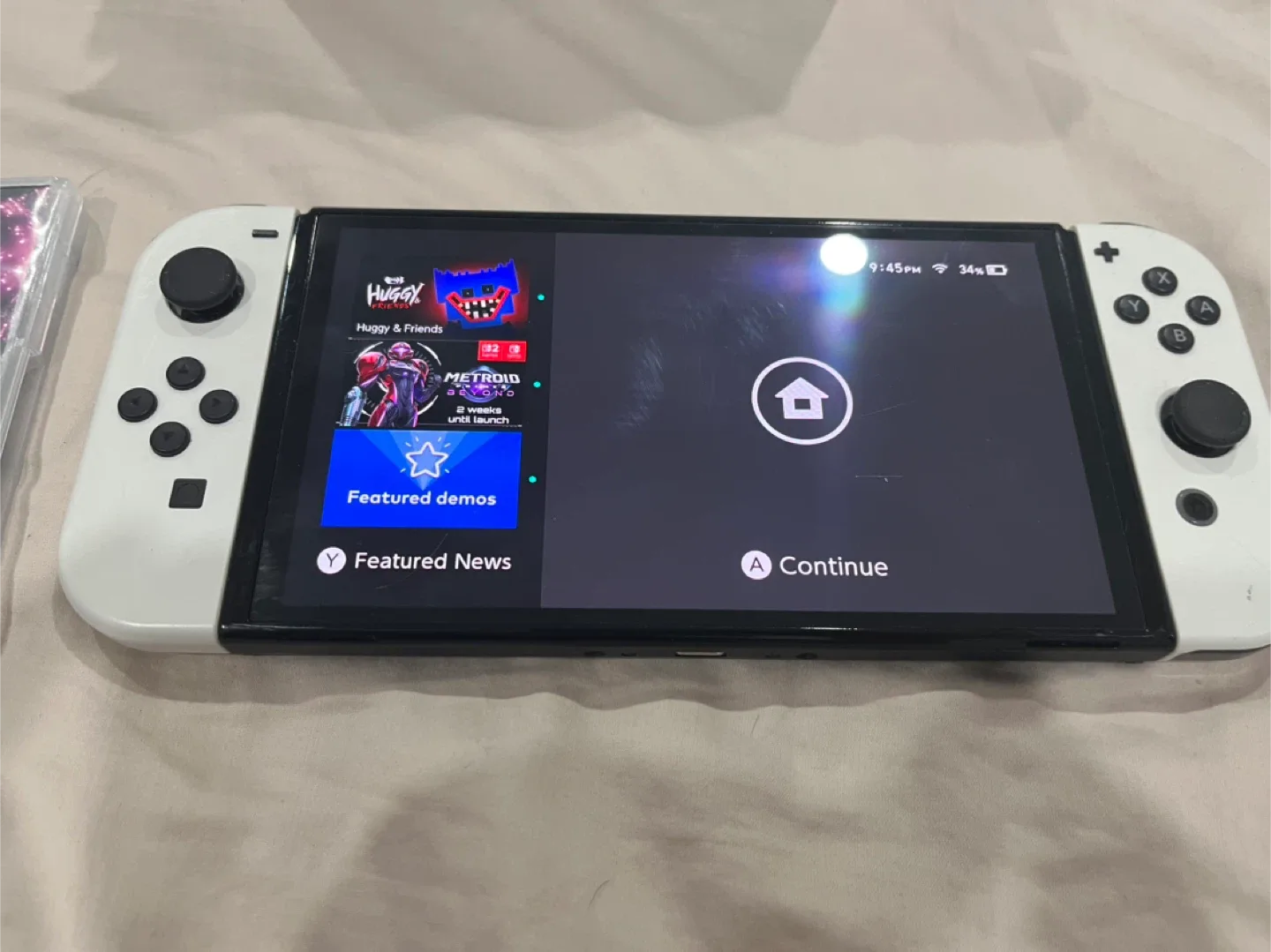 Nintendo Switch OLED with charging cable, doc, and games! image indicator(3)